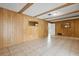 Large living room with paneled walls and tile flooring at 3994 Irma Shores Dr, Orlando, FL 32817