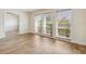 Bright living room featuring luxury vinyl floors, natural light, and a neutral paint color at 3994 Irma Shores Dr, Orlando, FL 32817