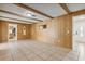Spacious living room featuring tile flooring and wood paneling at 3994 Irma Shores Dr, Orlando, FL 32817