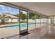 Enclosed patio offering a view of the sparkling swimming pool and backyard at 3994 Irma Shores Dr, Orlando, FL 32817