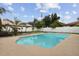 Backyard pool surrounded by concrete, a white fence, and tropical landscaping for outdoor enjoyment at 3994 Irma Shores Dr, Orlando, FL 32817