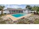 Backyard pool with a screened-in patio and space for entertaining at 3994 Irma Shores Dr, Orlando, FL 32817
