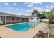 Backyard pool with screened-in lanai provides a relaxing outdoor space at 3994 Irma Shores Dr, Orlando, FL 32817