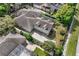 Aerial view of the two-story home with a large multi-car garage and backyard pool at 418 Curry Ct, Altamonte Springs, FL 32714