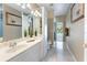 Bright bathroom featuring vanity with mirror, tile floor and pool view out the door at 418 Curry Ct, Altamonte Springs, FL 32714