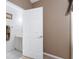 Ensuite bathroom doorway showing vanity and towel rack at 418 Curry Ct, Altamonte Springs, FL 32714