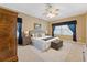 Warm, inviting bedroom boasts a plush rug, ceiling fan, and ample natural light from the window at 418 Curry Ct, Altamonte Springs, FL 32714