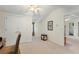 Well-lit bedroom with vaulted ceiling, closet, neutral carpet, side table, and view to attached bathroom at 418 Curry Ct, Altamonte Springs, FL 32714