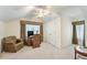Bright bedroom featuring closet, desk, neutral carpet, chair, ceiling fan, and a large window at 418 Curry Ct, Altamonte Springs, FL 32714