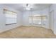 Spacious bedroom featuring multiple large windows on light carpet at 418 Curry Ct, Altamonte Springs, FL 32714