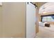 Inviting bedroom view shows a neutral color palette, plush rug, and a sliding barn door for added privacy at 418 Curry Ct, Altamonte Springs, FL 32714
