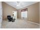 Cozy bedroom features a chair, ensuite bathroom and large window on light carpet at 418 Curry Ct, Altamonte Springs, FL 32714