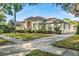 Well-maintained home featuring lush landscaping, a long driveway, and a well-maintained exterior at 418 Curry Ct, Altamonte Springs, FL 32714
