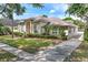 Attractive home with a neatly landscaped yard, a long driveway, and a well-maintained exterior at 418 Curry Ct, Altamonte Springs, FL 32714