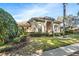 Well-maintained home featuring lush landscaping, a circular driveway, and a welcoming entrance at 418 Curry Ct, Altamonte Springs, FL 32714