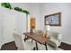 Bright home office featuring a desk with two chairs below an opening into another room at 418 Curry Ct, Altamonte Springs, FL 32714