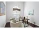 Bright home office featuring a window and two chairs adjacent to a dark wood desk on an area rug at 418 Curry Ct, Altamonte Springs, FL 32714