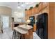 Eat-in kitchen featuring granite countertops, light wood cabinets, and stainless steel appliances at 418 Curry Ct, Altamonte Springs, FL 32714
