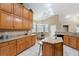 Spacious eat-in kitchen featuring oak cabinets, granite counters, and stainless appliances at 418 Curry Ct, Altamonte Springs, FL 32714