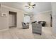 Living room with vaulted ceiling, ceiling fan, neutral colors, and ample seating at 418 Curry Ct, Altamonte Springs, FL 32714