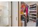 Well-organized walk-in closet with shelving for shoes and hanging rods for clothes, next to the main bathroom at 418 Curry Ct, Altamonte Springs, FL 32714