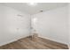 Neutral bedroom featuring modern vinyl floors, closet and access to an adjacent room at 4246 Clarinda St, Orlando, FL 32811