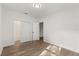 Bright bedroom featuring wood-look floors, natural light, and closet with sliding doors at 4246 Clarinda St, Orlando, FL 32811