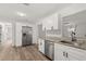 Spacious kitchen featuring stainless steel appliances and access to a serving hatch at 4246 Clarinda St, Orlando, FL 32811