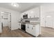 Cozy kitchen area featuring stainless steel appliances and white cabinets at 4246 Clarinda St, Orlando, FL 32811