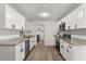 Bright kitchen featuring white cabinets, stainless steel appliances and granite countertops at 4246 Clarinda St, Orlando, FL 32811