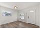 Bright room with wood-look floors and natural light streaming in from the front windows at 4246 Clarinda St, Orlando, FL 32811