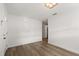 Bright living room features modern lighting, wood-look floors, and ample space at 4246 Clarinda St, Orlando, FL 32811