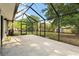 Spacious screened-in porch with a beautiful backyard view and outdoor seating at 4246 Clarinda St, Orlando, FL 32811