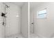 Walk-in shower featuring subway tile and marble-look tile flooring at 4246 Clarinda St, Orlando, FL 32811