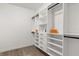 Bright walk-in closet with custom built-in shelving and ample hanging space for organized storage at 4246 Clarinda St, Orlando, FL 32811