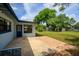 Backyard boasts a mix of patio styles, leading to a spacious grassy area with ample shed storage at 4415 Gilpin Way, Orlando, FL 32812