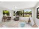 Bright bedroom features a large window, neutral paint, and tile flooring at 4415 Gilpin Way, Orlando, FL 32812