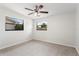 Clean bedroom features a new ceiling fan, neutral paint, and carpet flooring at 4415 Gilpin Way, Orlando, FL 32812