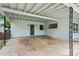 Spacious carport area with a white ceiling, offering covered parking at 4415 Gilpin Way, Orlando, FL 32812