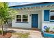Inviting entryway with a blue front door, complementing the home's exterior at 4415 Gilpin Way, Orlando, FL 32812