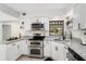 Modern kitchen featuring stainless steel appliances and updated countertops at 4415 Gilpin Way, Orlando, FL 32812