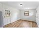 Bright mud room featuring a new floor and light fixture, window, and exterior access at 4415 Gilpin Way, Orlando, FL 32812