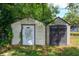 Backyard featuring multiple sheds, offering convenient outdoor storage solutions at 4415 Gilpin Way, Orlando, FL 32812