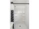 Modern shower features built in shelves and fresh paint at 4415 Gilpin Way, Orlando, FL 32812