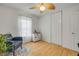 This bedroom has hardwood floors, a leaf-style ceiling fan, and a closet at 4443 Doris Dr, New Smyrna Beach, FL 32169