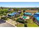 An aerial view showcasing the Chesterbrook community's architecture, pool, and landscaping at 500 Newell Hill Rd # 113A, Leesburg, FL 34748