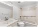 Bright bathroom showcasing a tiled shower-tub combo and a marble-topped vanity at 500 Newell Hill Rd # 113A, Leesburg, FL 34748