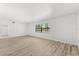 Bright bedroom with wood-look floors and a window allowing natural light at 500 Newell Hill Rd # 113A, Leesburg, FL 34748