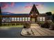 Striking clubhouse entrance featuring Tudor-style accents and well-maintained landscaping at 500 Newell Hill Rd # 113A, Leesburg, FL 34748