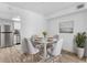 Cozy dining area featuring modern table, stylish seating, and adjacent updated kitchen at 500 Newell Hill Rd # 113A, Leesburg, FL 34748